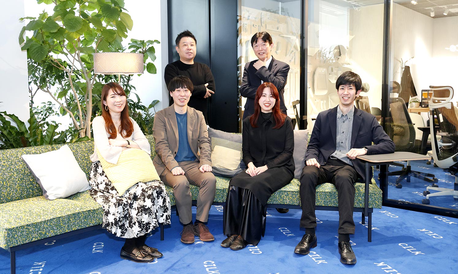 Project members gathered on the sofa